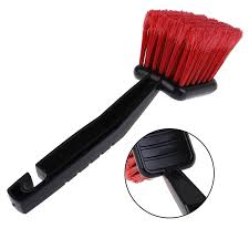 Long-Handle Tire and Wheel Scrub Brush, in car detailing for cleaning heavy road grime, mud, and brake dust.